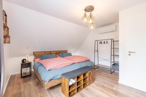 Postel nebo postele na pokoji v ubytování Alsace Moderne - T2 60 m2, terrasse, fibre & Netflix - Niederbronn-les-Bains