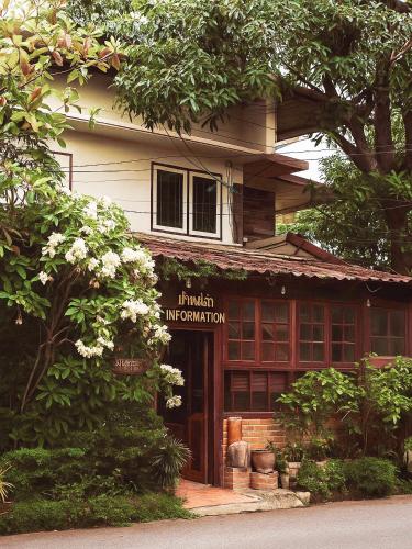a building with a sign that reads it indian immigration at Boutique House Nipha in Chiang Mai