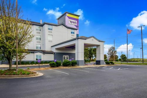 a front view of a hotel with a parking lot at Spark by Hilton Lynchburg in Lynchburg