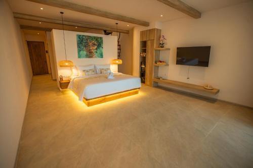 Ένα ή περισσότερα κρεβάτια σε δωμάτιο στο Bohemian Beachfront Apartments