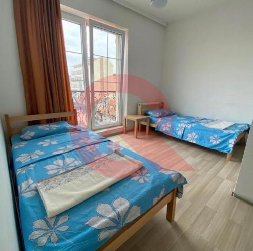 Ένα ή περισσότερα κρεβάτια σε δωμάτιο στο Cozzy Apartment