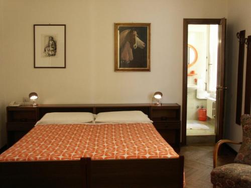 Postel nebo postele na pokoji v ubytování Albergo Corona