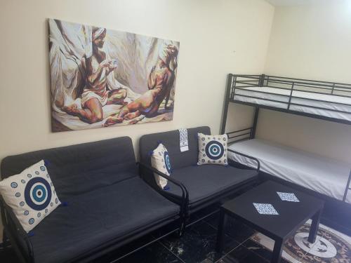 a living room with a couch and a bunk bed at Angelina's Home and Spa Alexandroupolis in Alexandroupoli