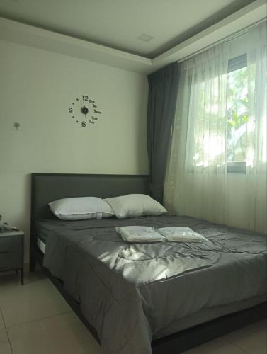 Ένα ή περισσότερα κρεβάτια σε δωμάτιο στο Arcadia Beach Continental By Palmera Pattaya