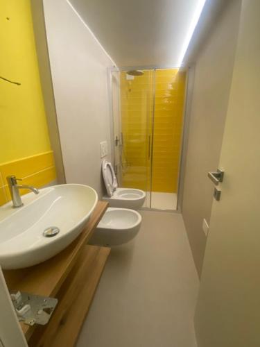 a bathroom with a sink and a toilet at Mediterranea in Arenzano