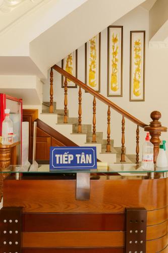 a sign for a help team in a synagogue at Sao Mai Hotel Can Tho in Can Tho
