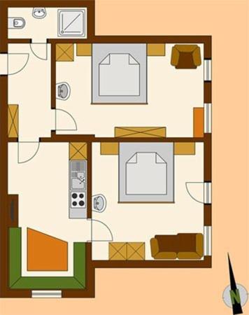 a floor plan of a house with furniture at Ferienwohnungen Lechthaler in Wenns