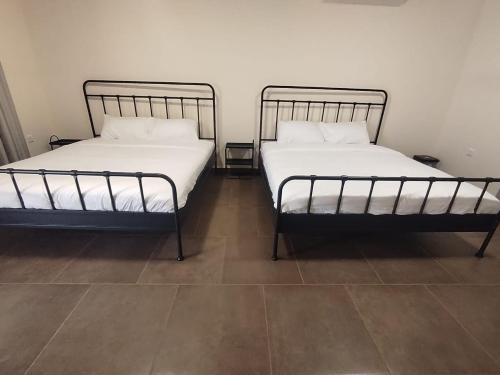 Ένα ή περισσότερα κρεβάτια σε δωμάτιο στο Al Saada Farm Stay