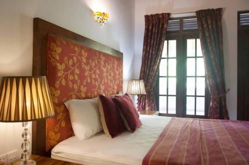 Postel nebo postele na pokoji v ubytování Phoenix Retreat Luxury Villa, Sri Lanka