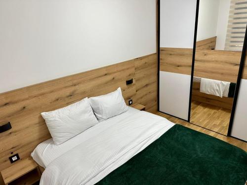 Postel nebo postele na pokoji v ubytování Gold Apartman