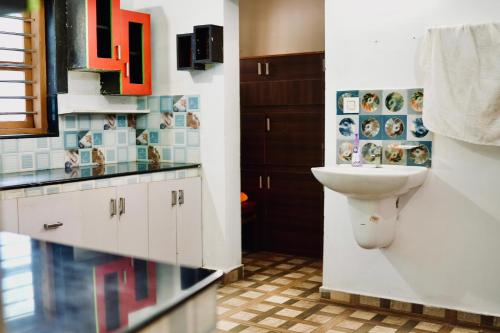 a bathroom with a sink and a toilet at Nyx Villa in Jāmb