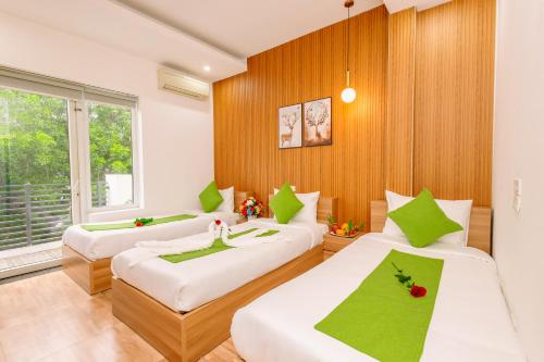 Ένα ή περισσότερα κρεβάτια σε δωμάτιο στο Hanoi Grand Sun Hotel