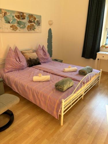 a bedroom with a large bed with two pillows on it at Ferienwohnung Hakuna Matata in Bad Aussee