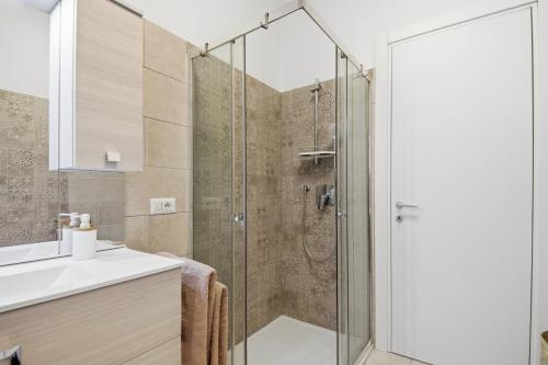 Ένα μπάνιο στο Figarolo apartment by Residence Moresca