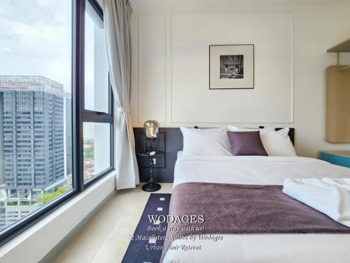 Ένα ή περισσότερα κρεβάτια σε δωμάτιο στο 22 Macalisterz George Town by Wodages