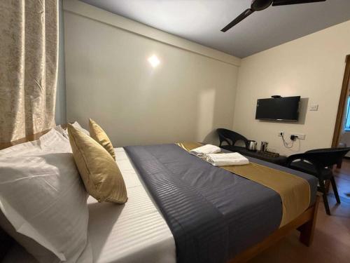 Postel nebo postele na pokoji v ubytování Hotel O Ram residency