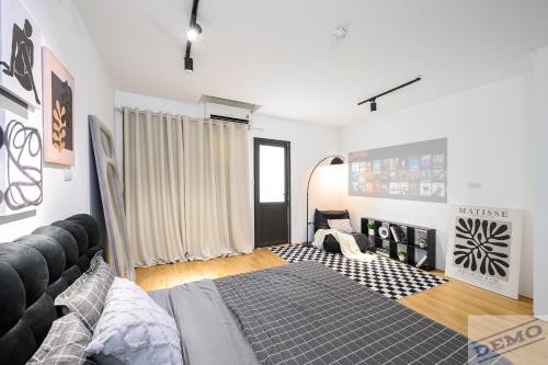 a living room with a bed and a couch at Love Paradise Hotel Hà Nội in Hanoi