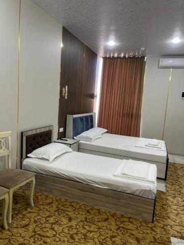 Postel nebo postele na pokoji v ubytování Vira Hotel