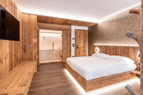 Ένα ή περισσότερα κρεβάτια σε δωμάτιο στο Salvans Wellness Apartments