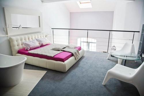 Postel nebo postele na pokoji v ubytování Loft Suite