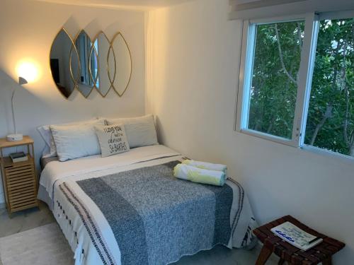 Postel nebo postele na pokoji v ubytování Maison des Brin - Lorient Camaruche