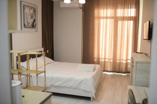 Postel nebo postele na pokoji v ubytování Despina Skyline