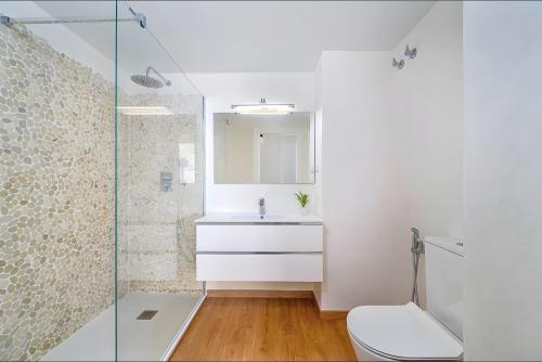 a bathroom with a toilet and a sink and a shower at Apartment 511 Torresol, Sea Views in Nerja
