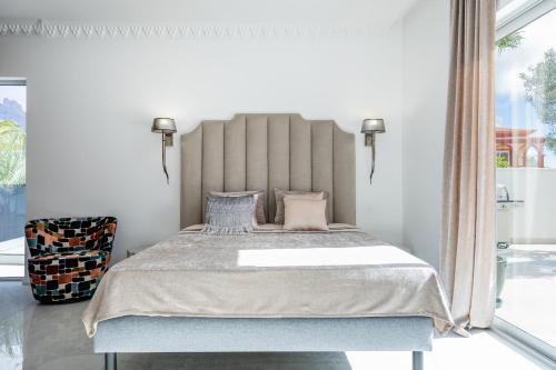 Postel nebo postele na pokoji v ubytování New Villa Los Olivos