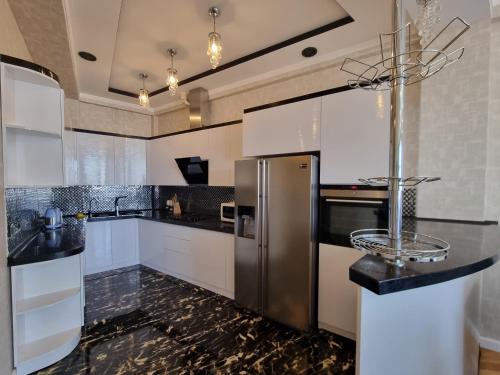 Kuchyň nebo kuchyňský kout v ubytování central apartment