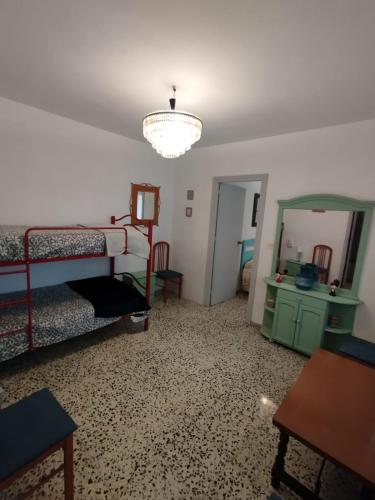 a bedroom with two bunk beds and a mirror at Lorca in Dúrcal