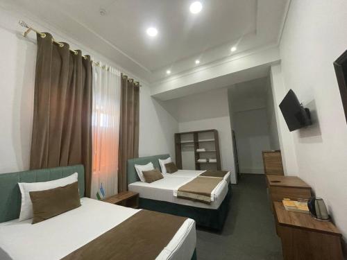 TV a/nebo společenská místnost v ubytování Avenue