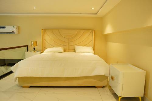 Postel nebo postele na pokoji v ubytování Amanah Serviced Apartments