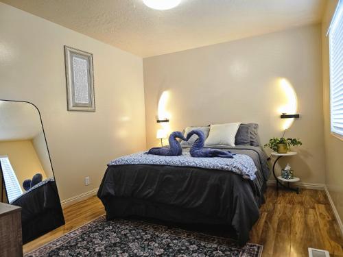 a bedroom with a bed with blue towels on it at Spacious Ski Base Near The Best Resorts in Salt Lake City