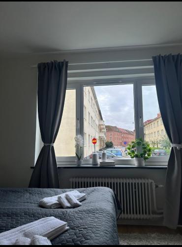 Ένα ή περισσότερα κρεβάτια σε δωμάτιο στο Södra innerstadens pärla