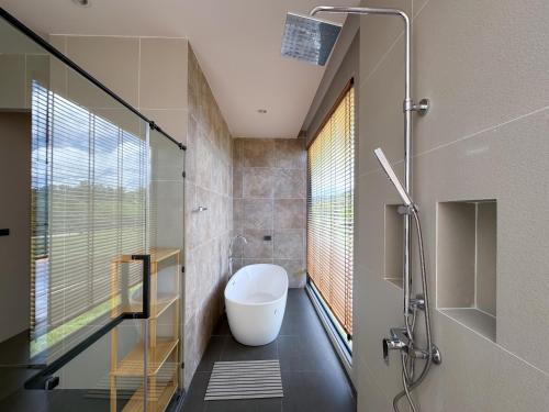 a bathroom with a shower and a white toilet at Luxury 3-Bedroom Pool Villa Long One B9 with Panoramic Chalong Bay View in Ban Bo Rae