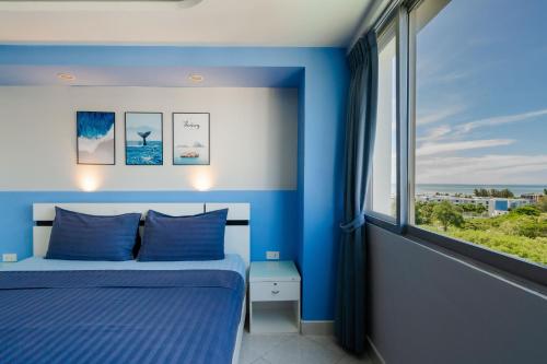 Un pat sau paturi într-o cameră la First Hua Hin Condo - Hin Nam