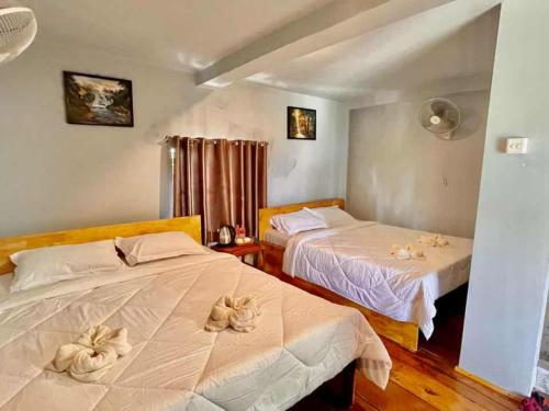 Ένα ή περισσότερα κρεβάτια σε δωμάτιο στο The Cliff Hostel, M'Pay Bay