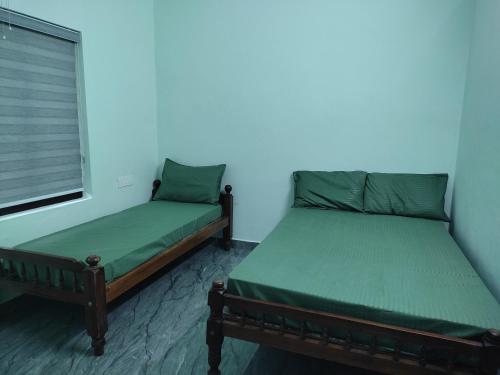 Postel nebo postele na pokoji v ubytování Green wayanad homestay