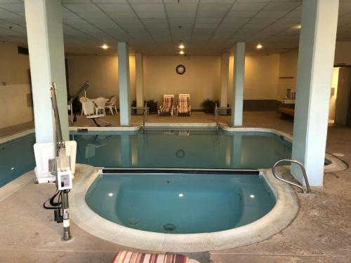 a jacuzzi tub in the middle of a building at Modern Condo with Ski In & Ski Out - Silver Creek Lodge, Snowshoe in Snowshoe