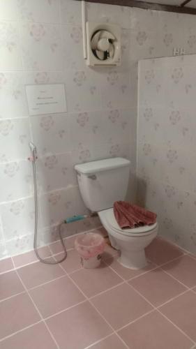 a bathroom with a toilet and a shower at Phi Phi Green Hill Resort in Phi Phi Islands