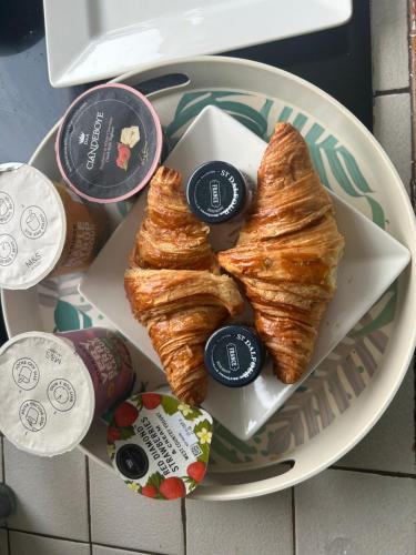 a plate of food with croissants on a table at Hollowdene in Gilford