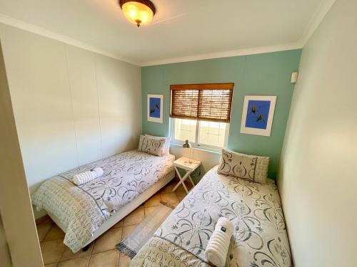 Ένα ή περισσότερα κρεβάτια σε δωμάτιο στο Sealavie Central Apartment