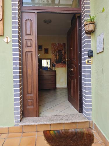 an entrance to a house with a door open at Bed&Breakfast Castagna in Carlopoli