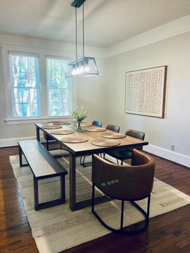 a dining room with a table and chairs at Cozy house 15 mins to Fort Benning in Central Columbus in Columbus