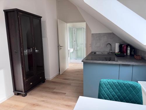 a kitchen with a sink and a counter at Bothfeld Suite in Hannover