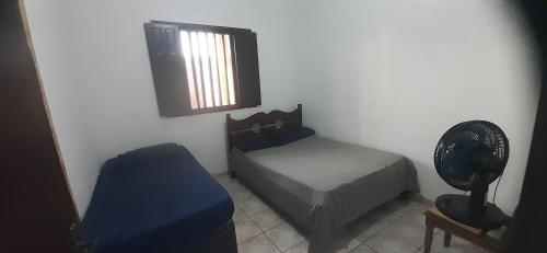 Postel nebo postele na pokoji v ubytování Casa a 20 metros da praia, simples com ótimo custo benefício - Mucuri, Ba