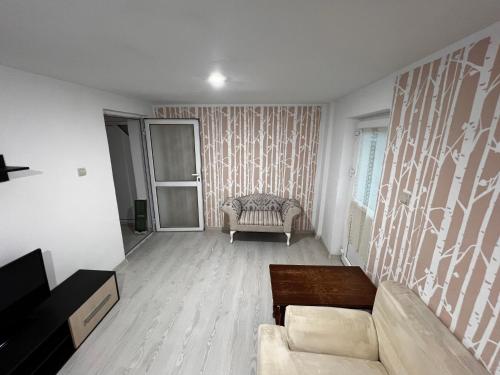 Posezení v ubytování Cozy Loft Craiova 1
