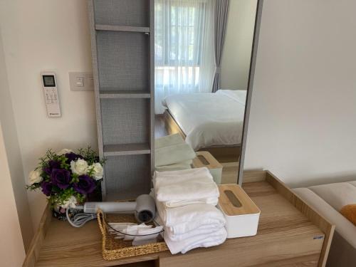 a small room with a mirror and a bed at Sleep Shot Pool Villa in Ban Fang Min
