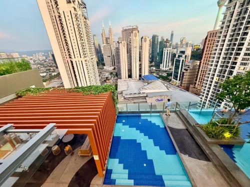 a pool on the roof of a building at Kuala Lumpur Luxury Suites By Majestic Residence in Kuala Lumpur