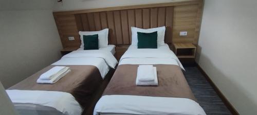 Postel nebo postele na pokoji v ubytování Tahtapul Expo Hotel